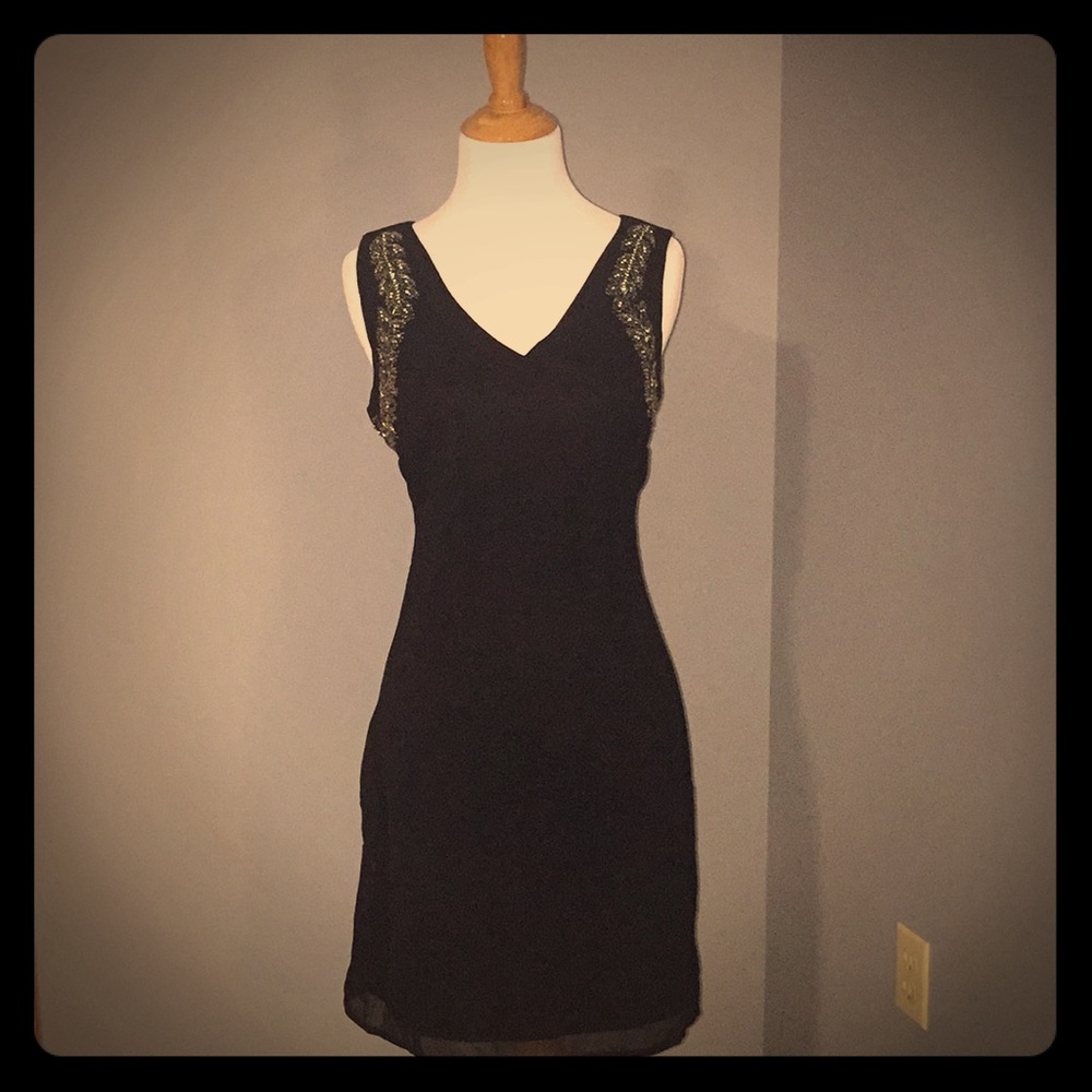 Black sleeveless dress with silver beading